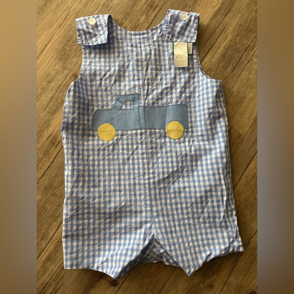 Blue and white reversible shortall offering truck and Easter bunny!